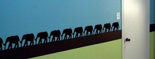 elephants holding tails